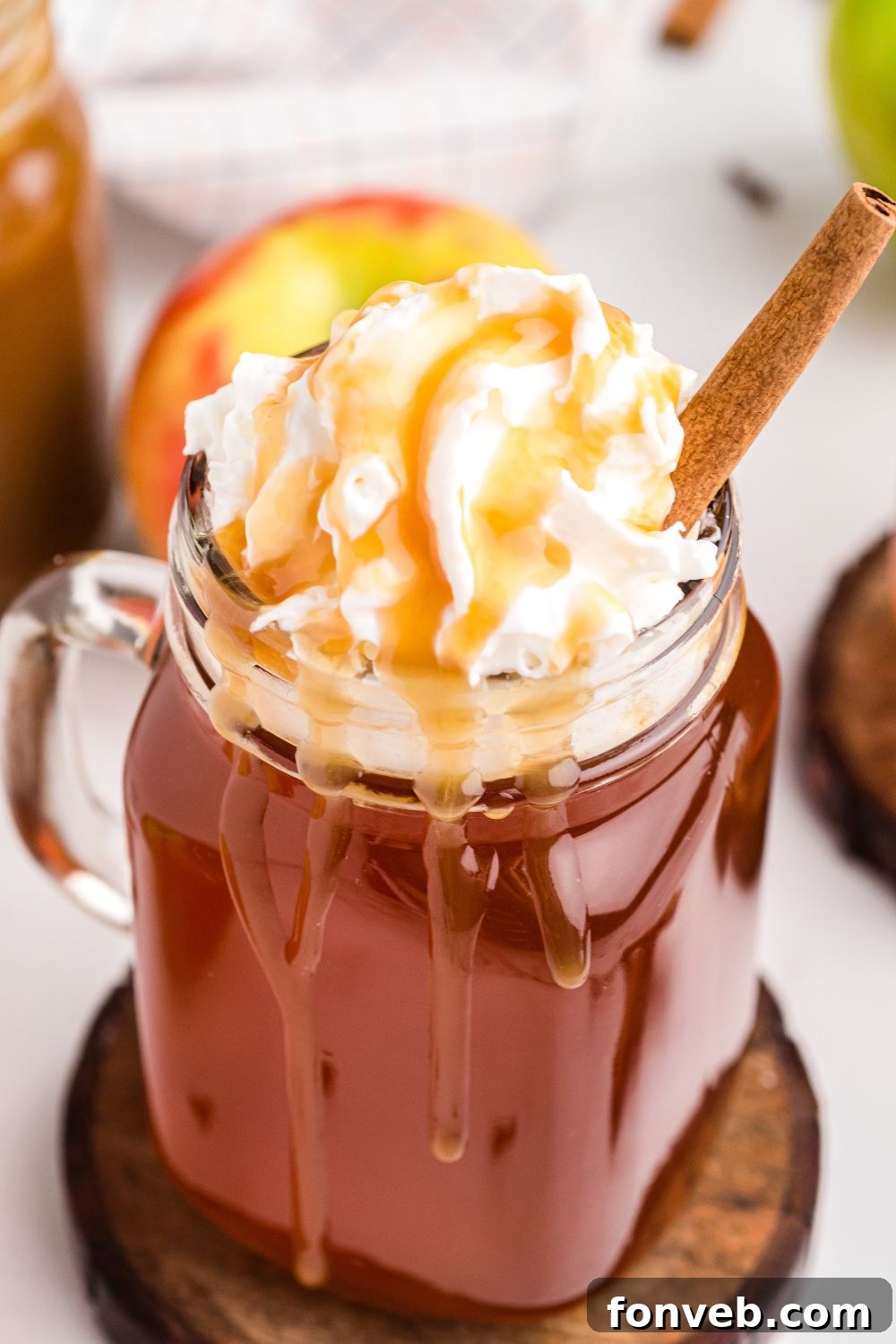 Cozy Caramel Apple Brew 10 A warm, inviting fall drink in a decorative glass, perfect for cozy moments.