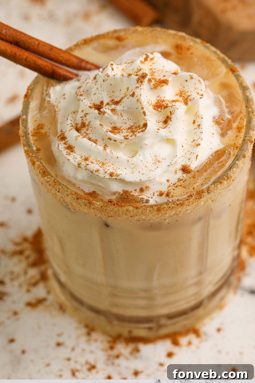 A side view of a Kahlua vodka cocktail presented on a table, highlighting its distinct layers and appealing presentation.