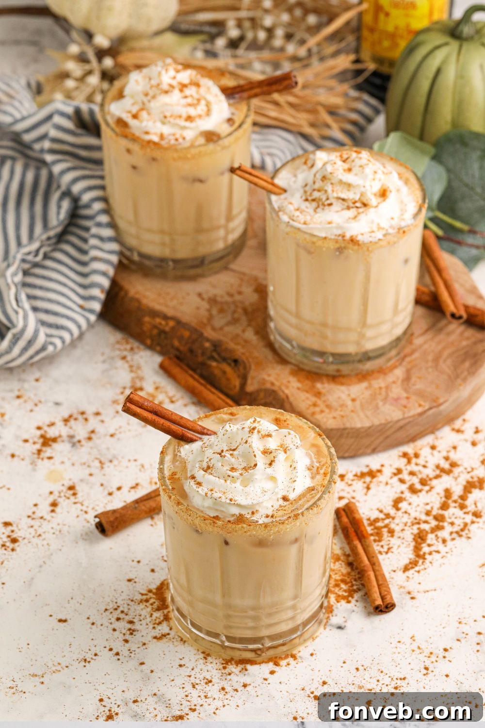 Elegantly presented cocktails on a table, adorned with festive decor, creating a sophisticated and welcoming atmosphere.