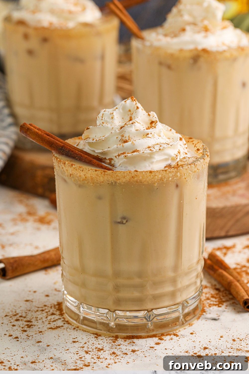 Several glasses of white pumpkin russian cocktails on a table, inviting guests to enjoy the creamy, seasonal beverage.