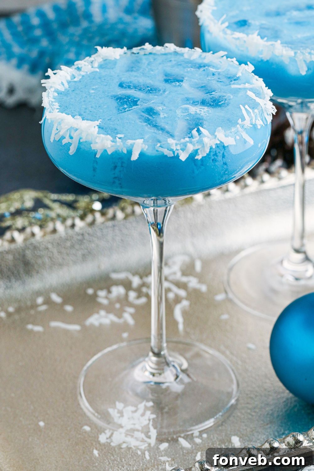 A beautifully illuminated light blue drink on a table, creating a serene and inviting ambiance