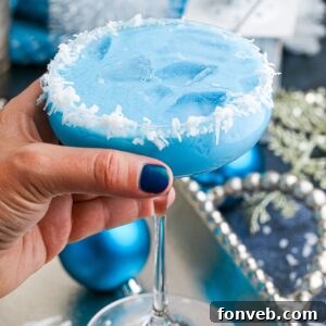 Blue Christmas Cocktail in hand