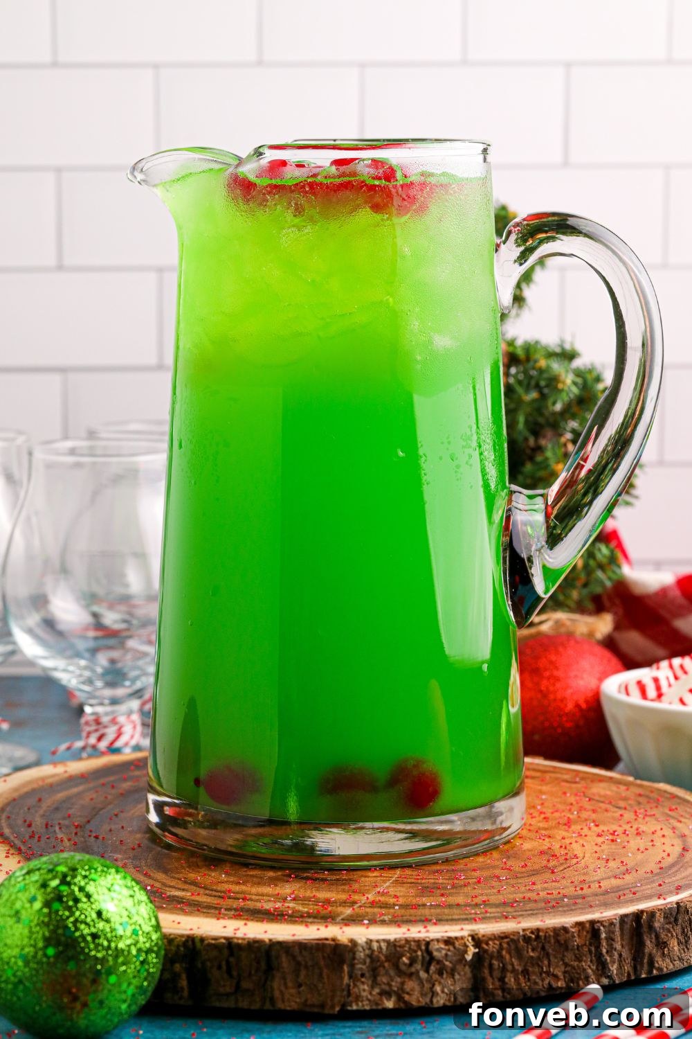 non alcoholic punch on table with cherries and ice on top of container 