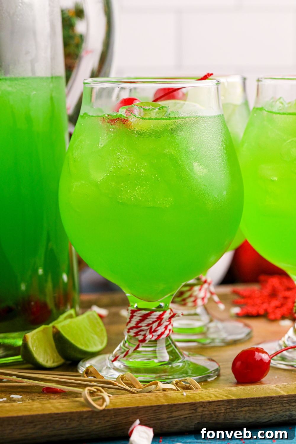 punch in glasses and a pitcher with extra punch in it