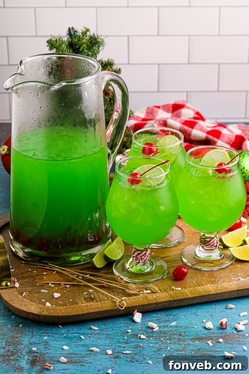 Grinch Punch on table in glasses and a pitcher 