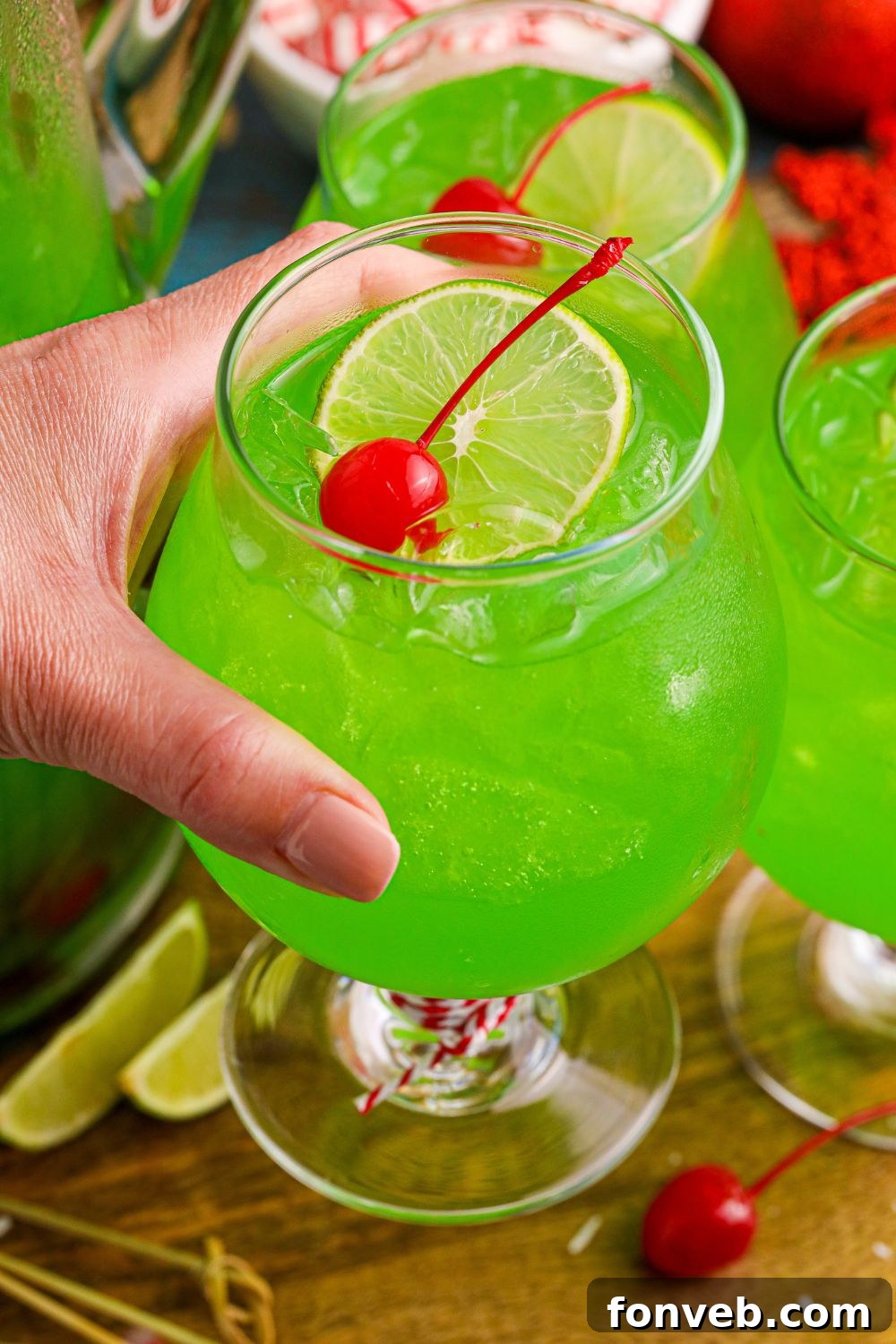 holding a Christmas punch in hand