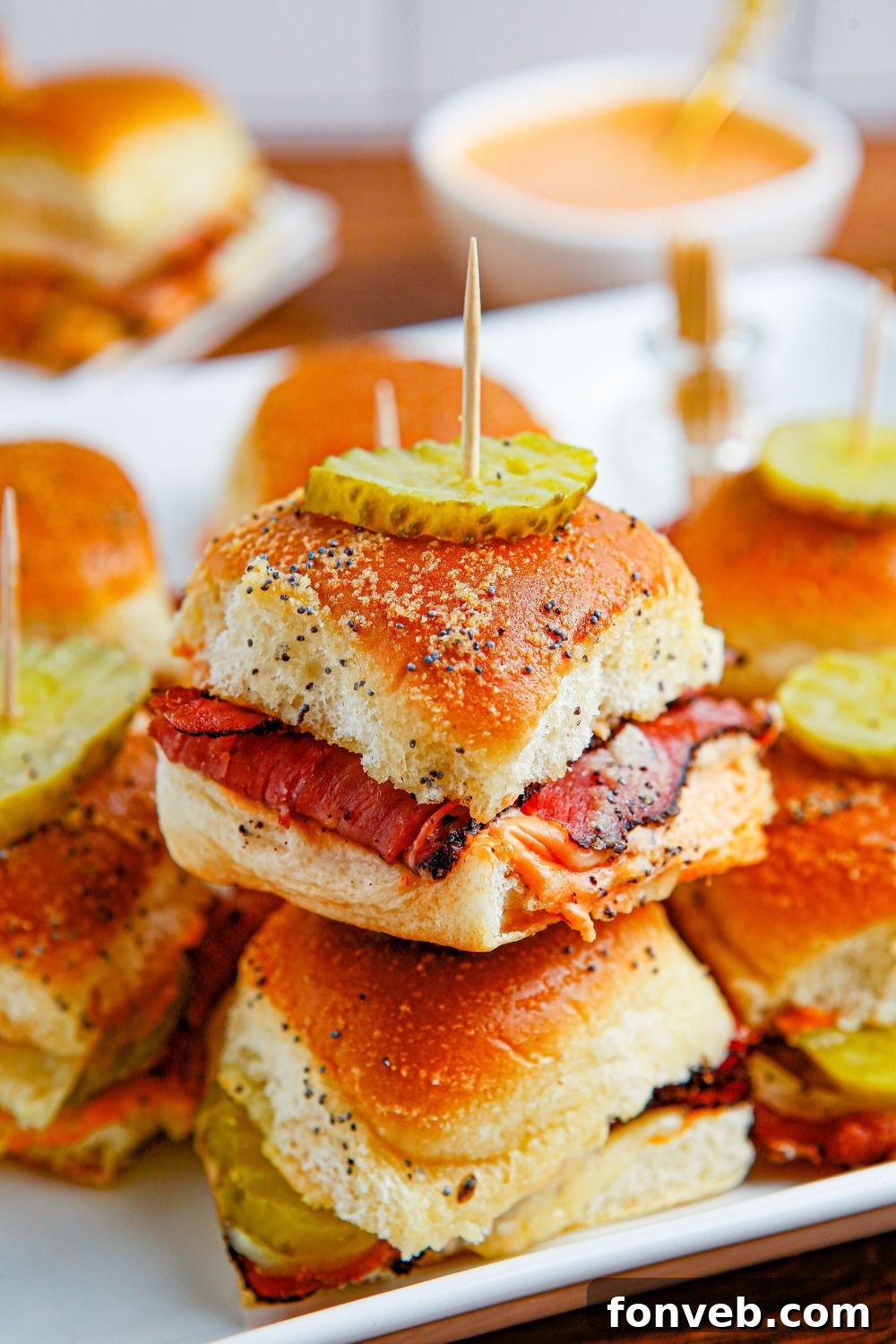 stacked sliders on buns on table