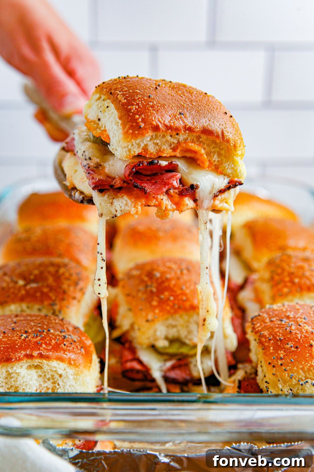 cheesy slider pulling out of pan 