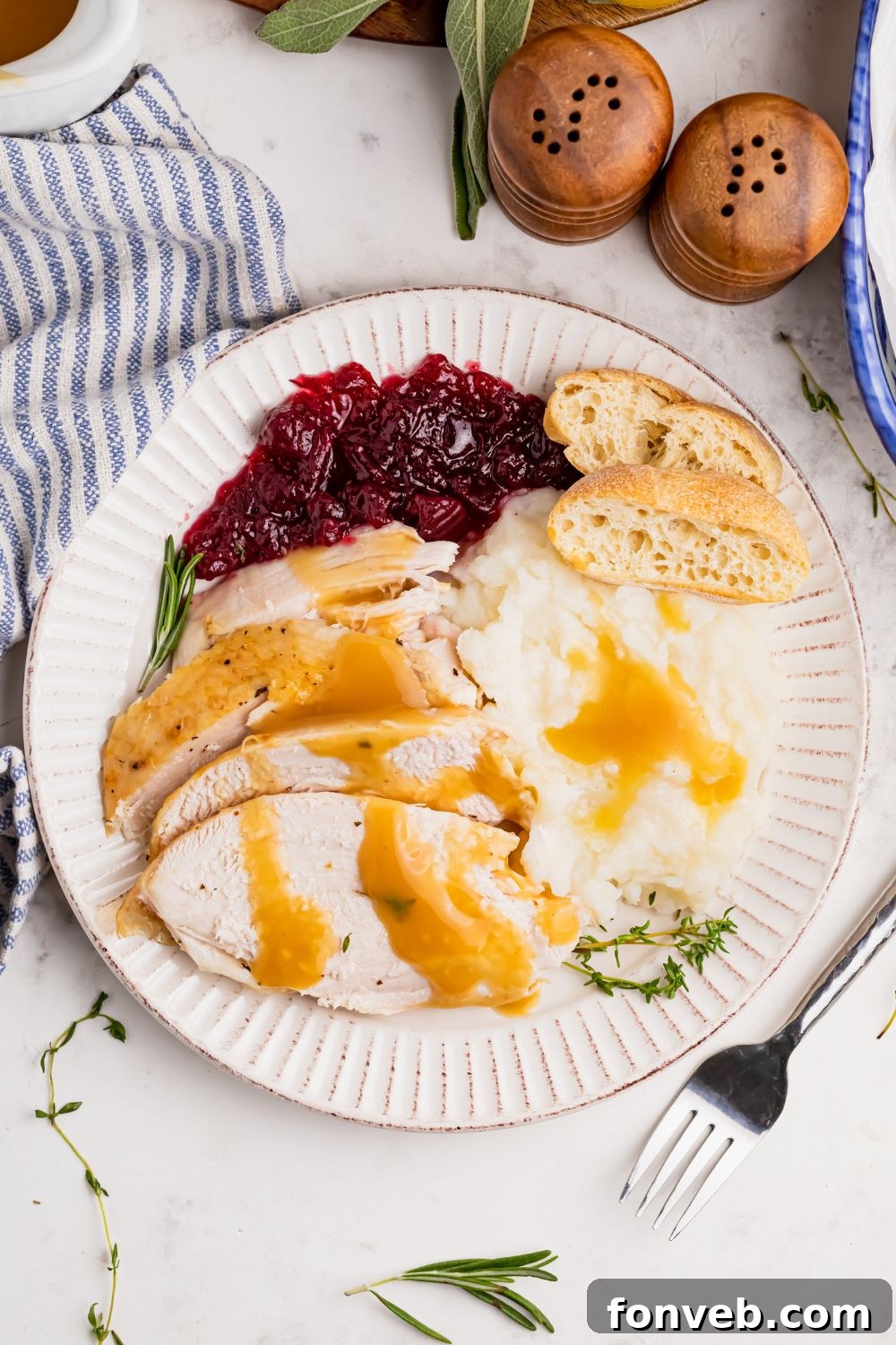 overhead plate with turkey and mashed potatoes and more on table