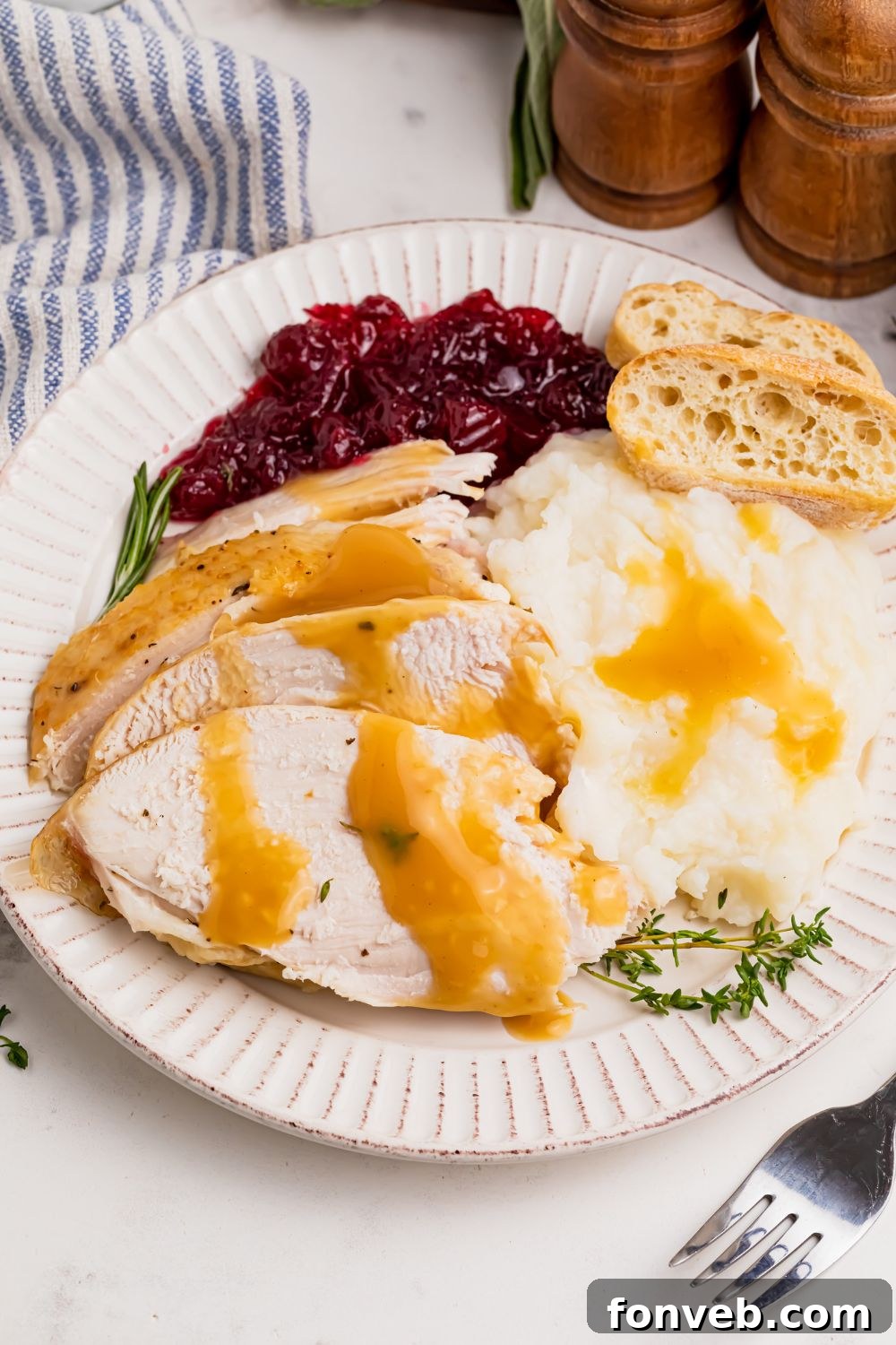 roasted turkey on table with food around it