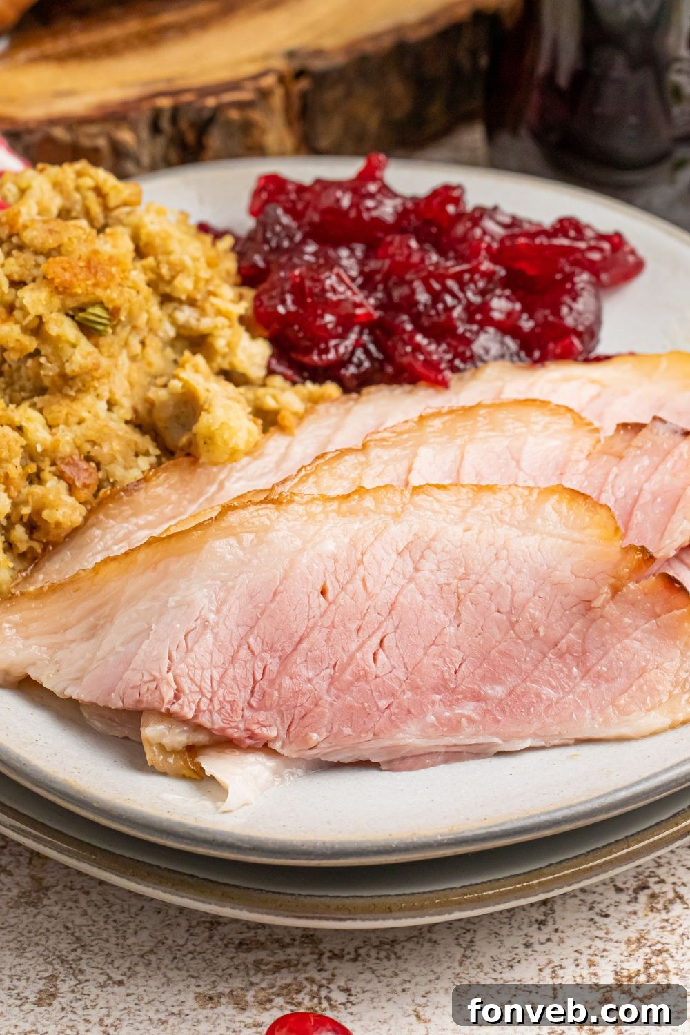 coca cola glazed ham and sides on a white plate on table