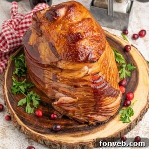 Coca Cola Ham on a wooden platter with garnish around it