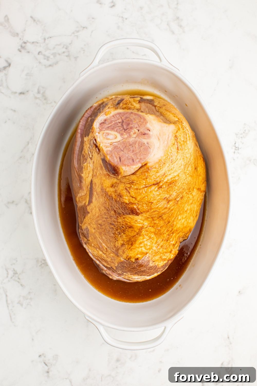 ham and coke mixture in a pan on table