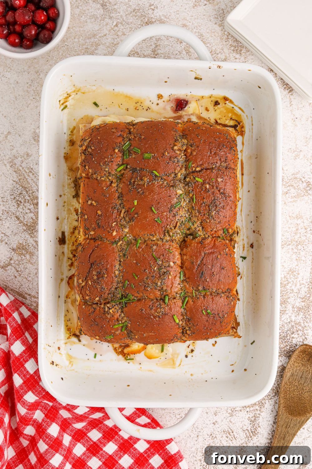 Baked sliders golden brown in the pan, fresh out of the oven
