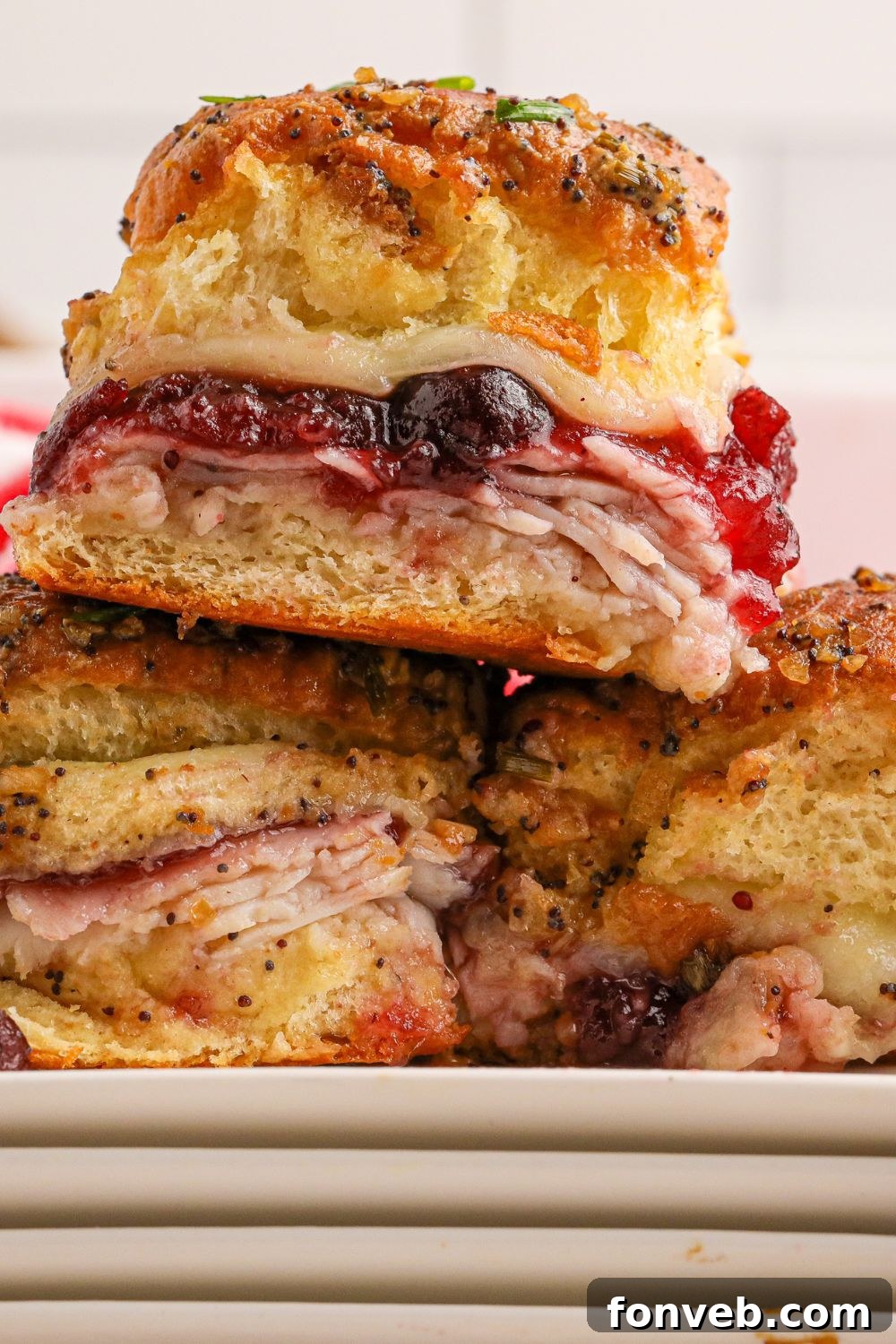 Thanksgiving sliders stacked on top of each other on a table, ready to be served
