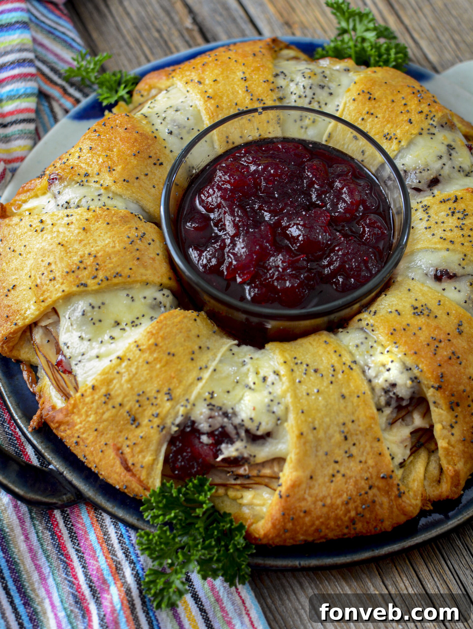 Turkey Crescent Roll Ring with a bowl of cranberry sauce in the center, perfectly presented