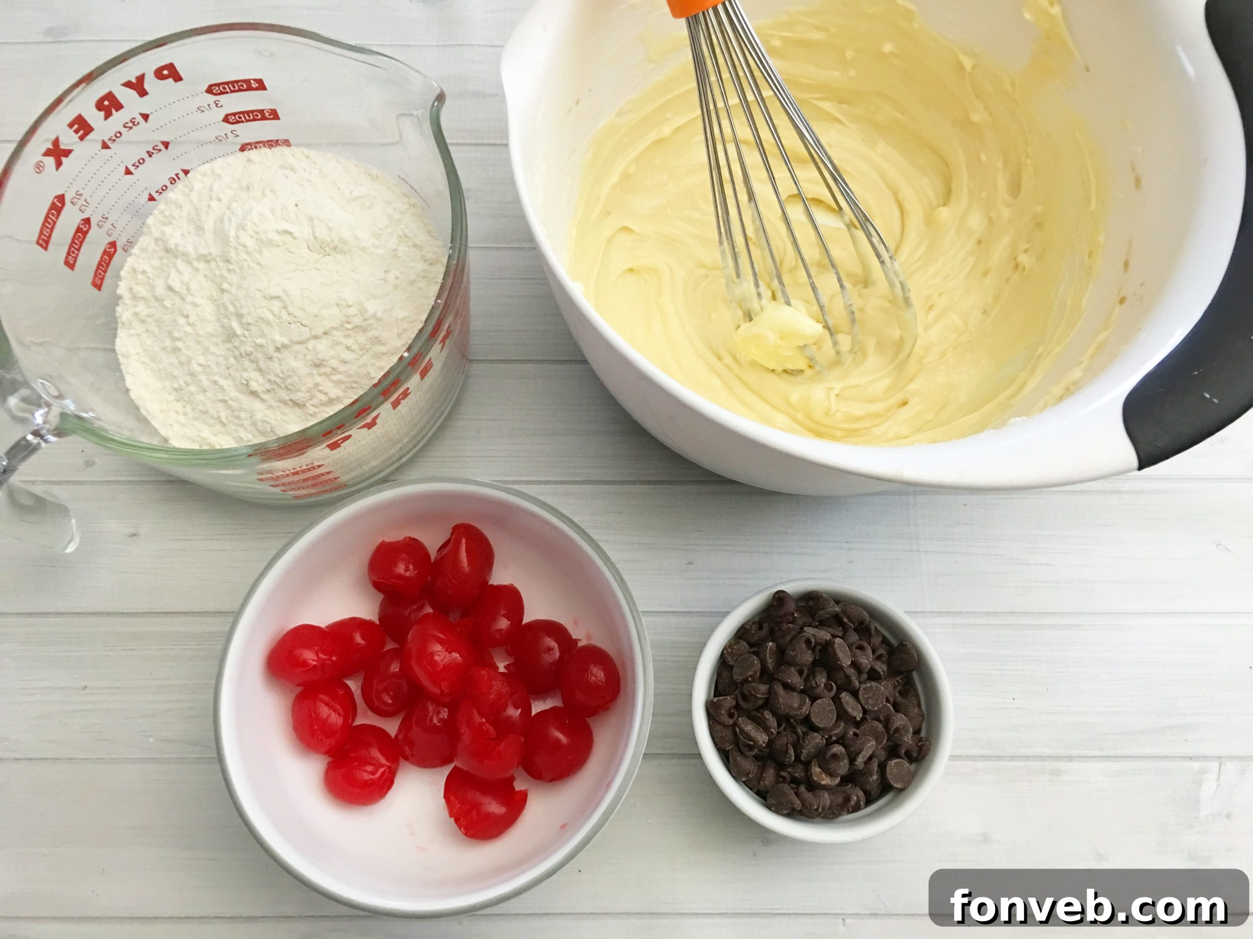 cookie dough being prepared with cherries