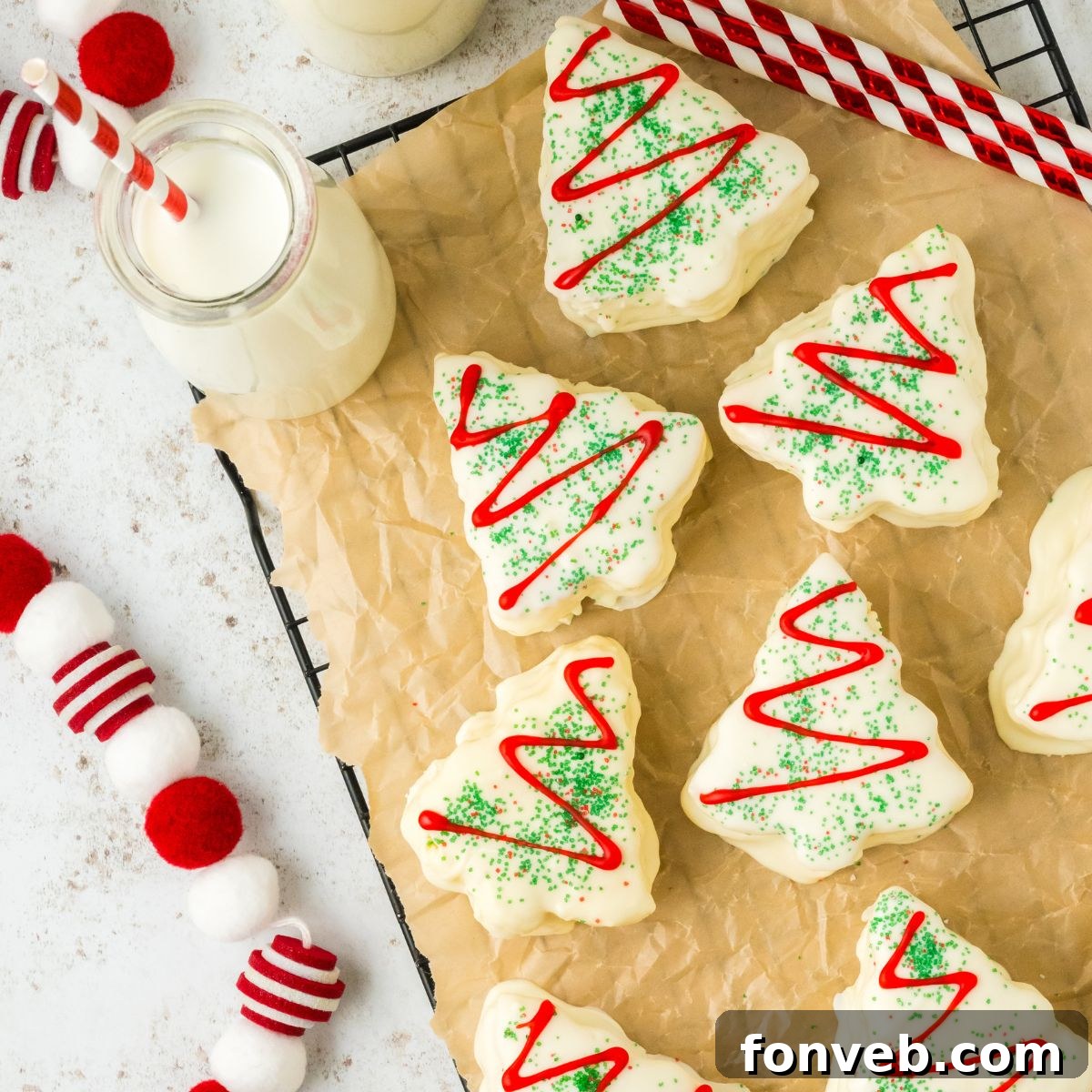 Christmas Tree Snack Cakes from Scratch 2 Festive homemade Christmas tree cakes displayed on a table with milk and holiday decorations