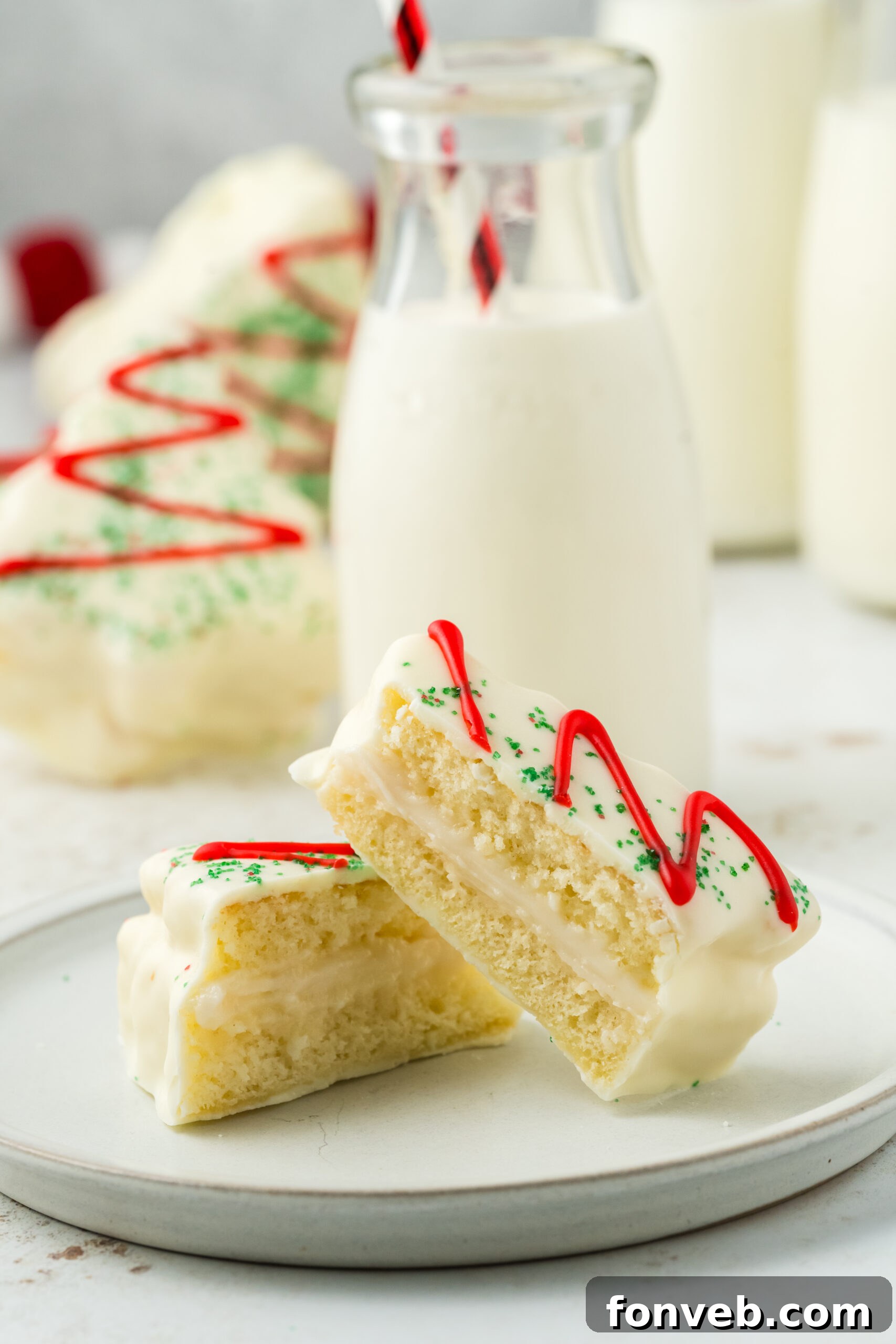 Christmas Tree Snack Cakes from Scratch 12 A copycat Little Debbie Christmas tree cake cut in half to show the creamy filling