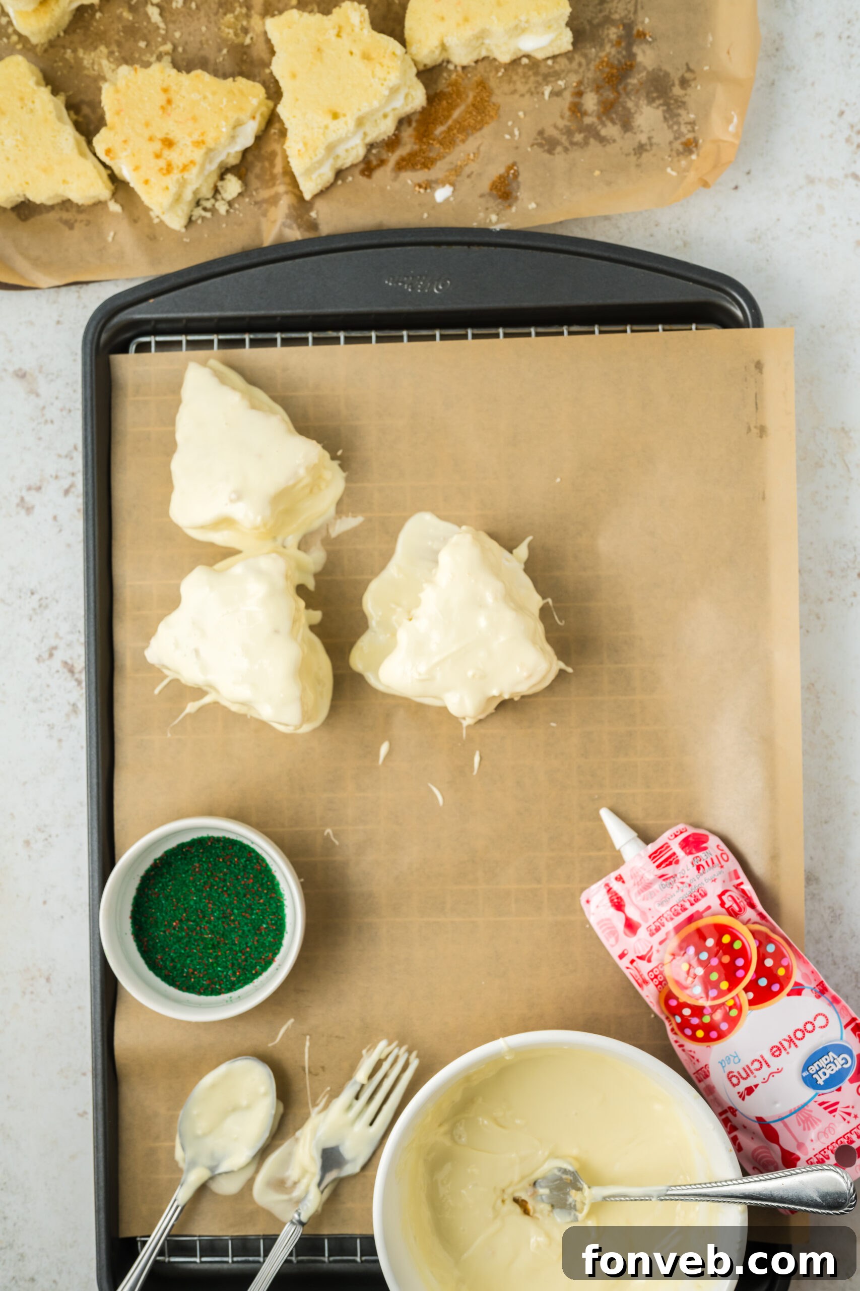 Christmas Tree Snack Cakes from Scratch 9 Several dipped Christmas tree shaped cakes resting on a tray