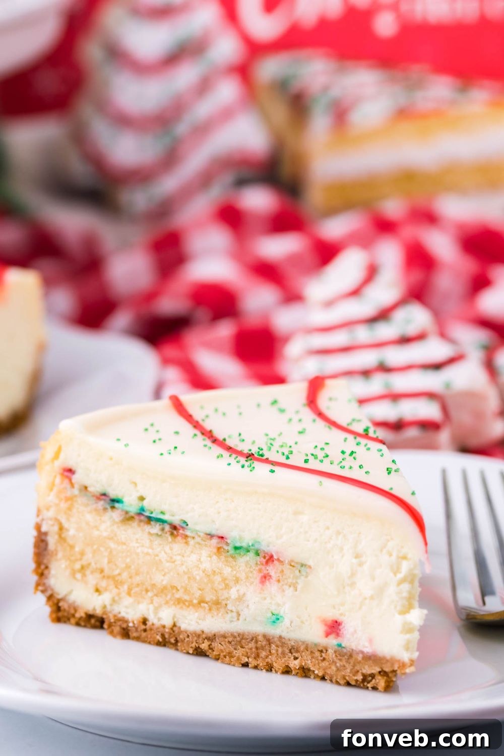CHristmas tree Little Debbies flavored slice of cheesecake on plate with fork by it