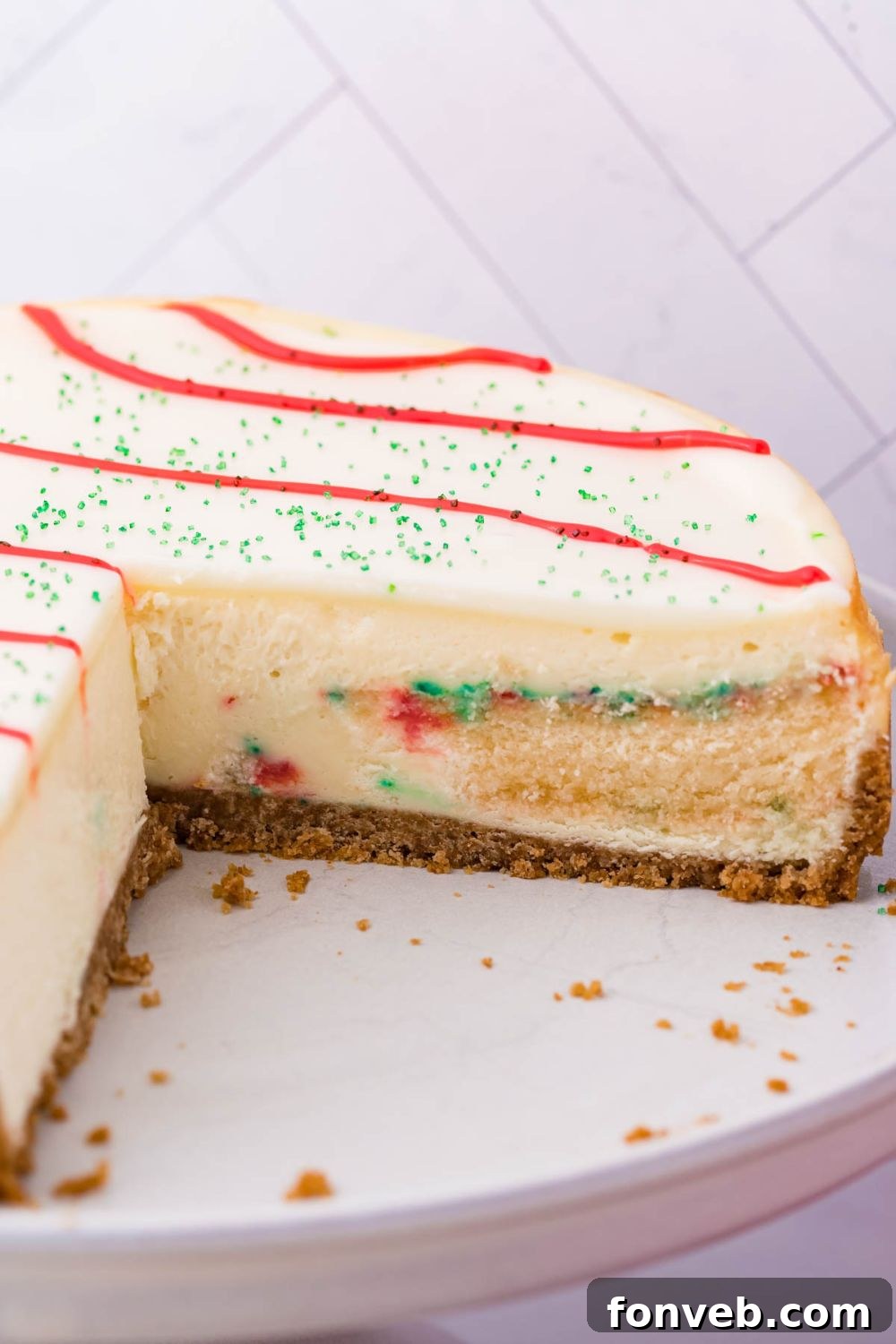 Little Debbie Christmas Tree Cheesecake with a few slices cut out on platter