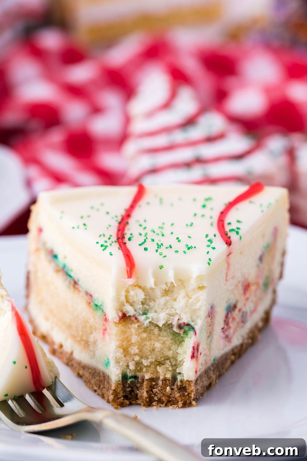 little debbie christmas tree cake cheesecake slice on plate with bite taken out