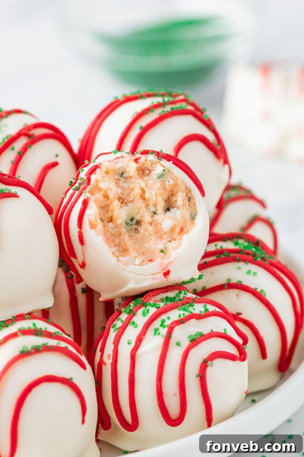 truffles in a bowl with one that has a bite taken out