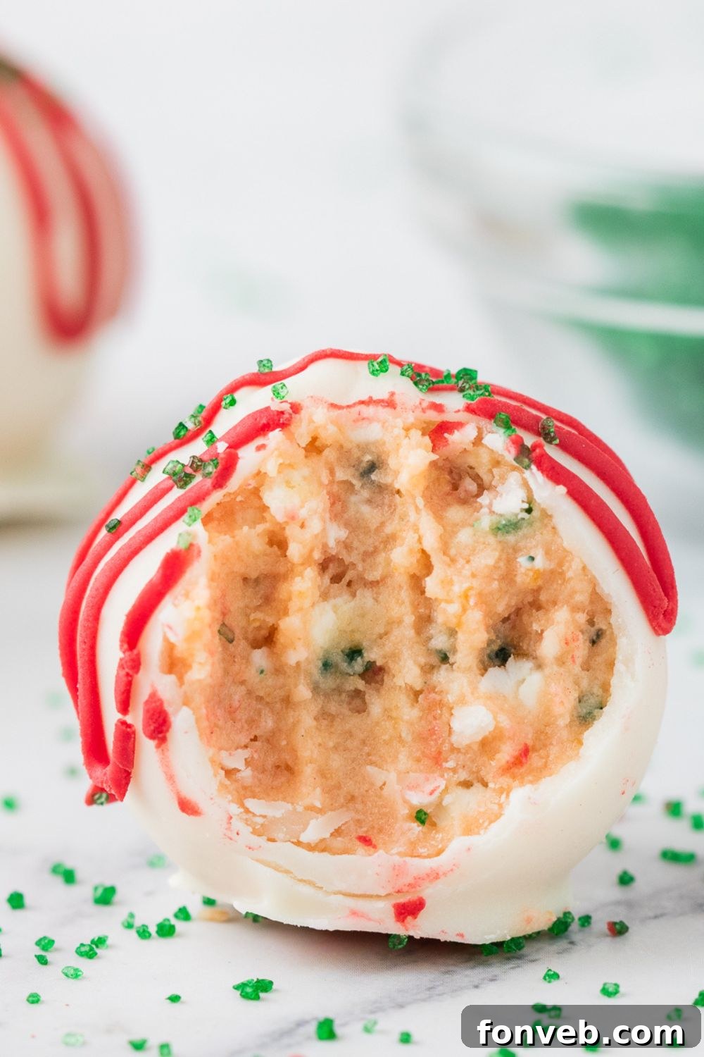 little debbie xmas tree cake bite with a bite taken out of it