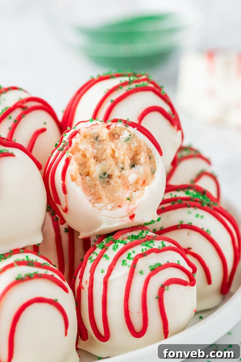 truffles in a bowl with one that has a bite taken out