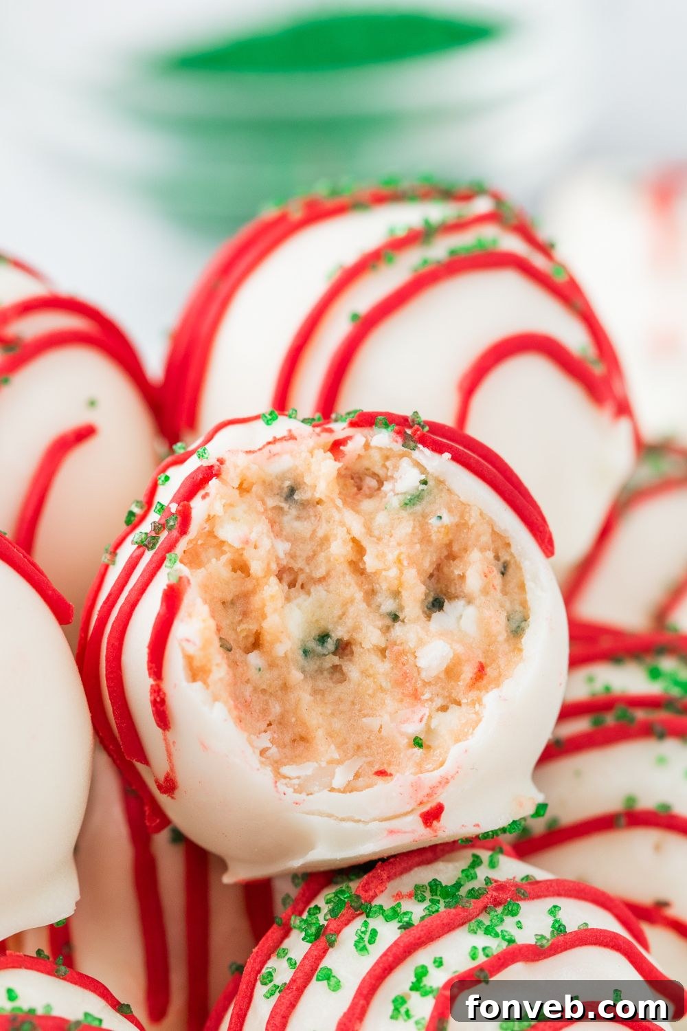 Little Debbie Christmas Tree Cake Truffles in bowl with bite taken out of it 
