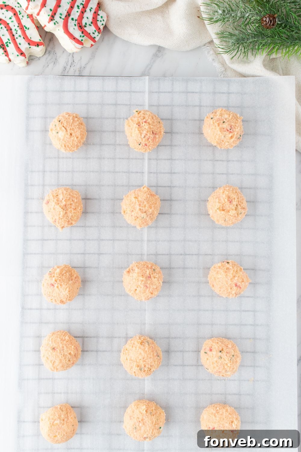 Christmas cake truffles on a lined cooling rack 