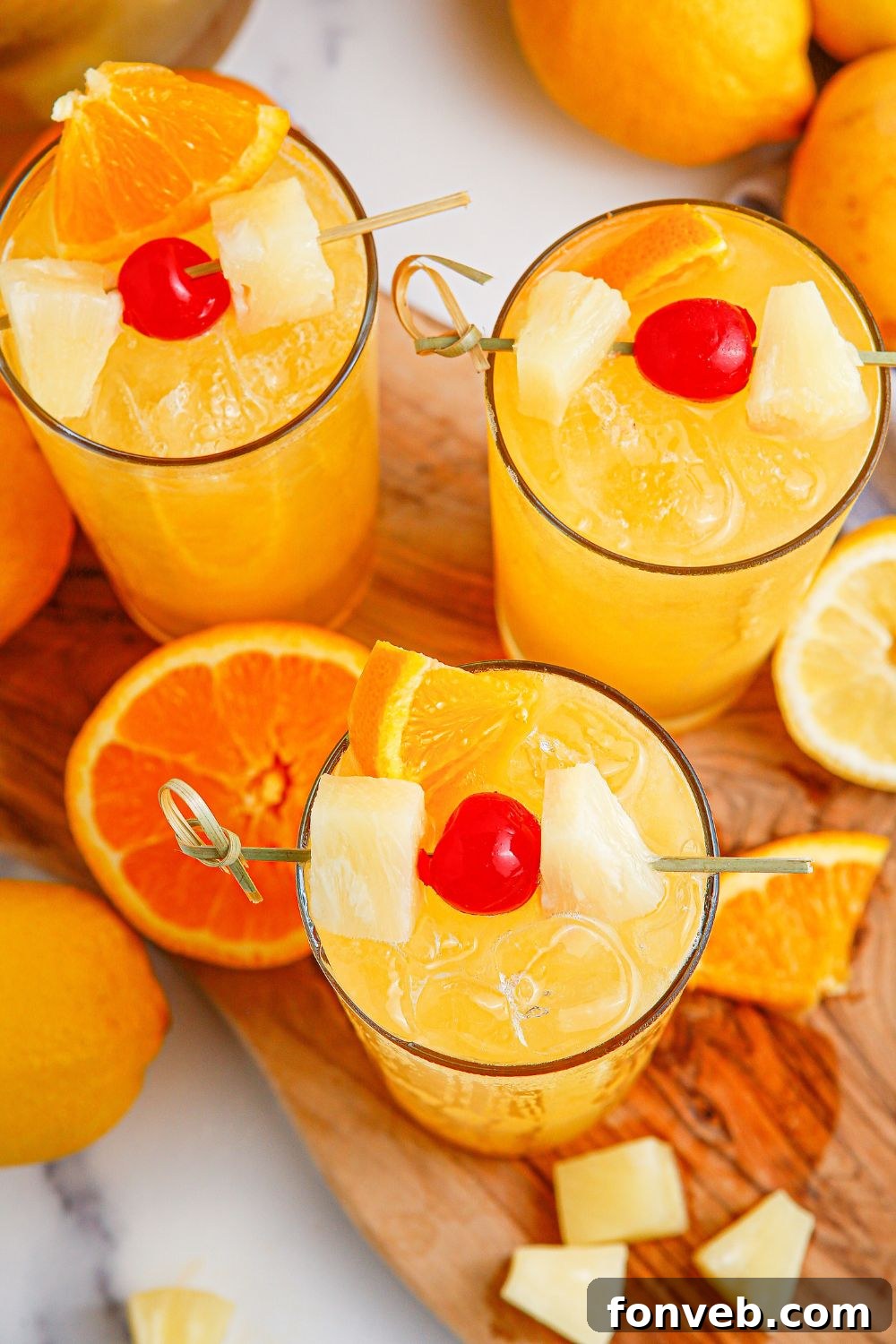 overhead view of party punch on table with cherry garnish on top 