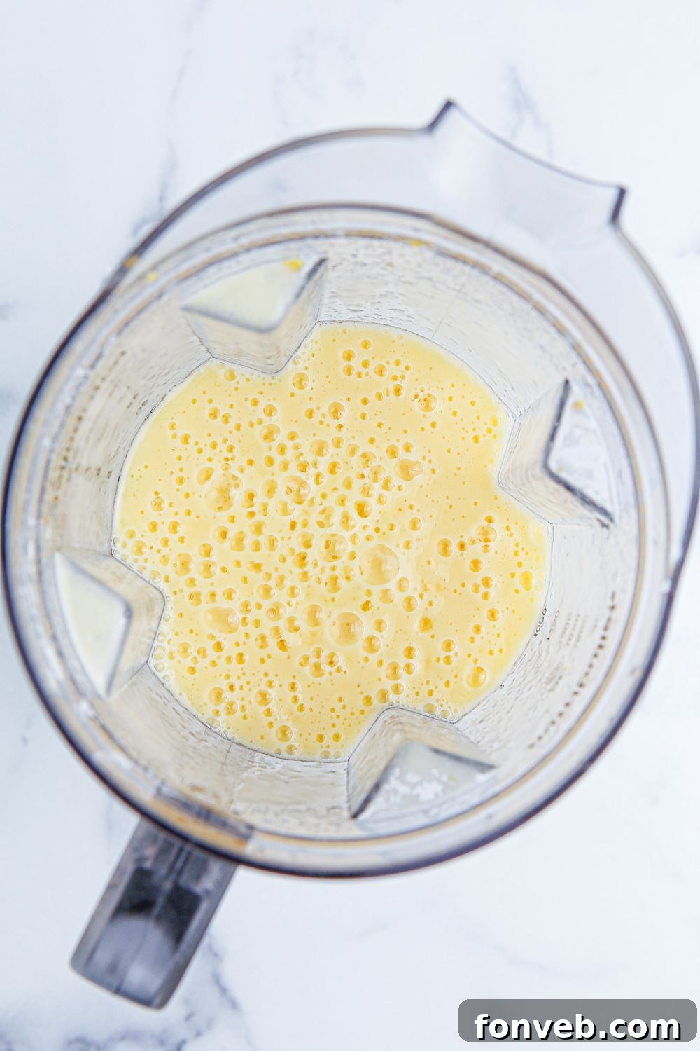 food processor with ingredients blended 