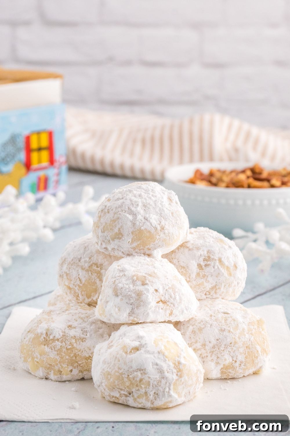 powder cookies stacked on a cookie tray
