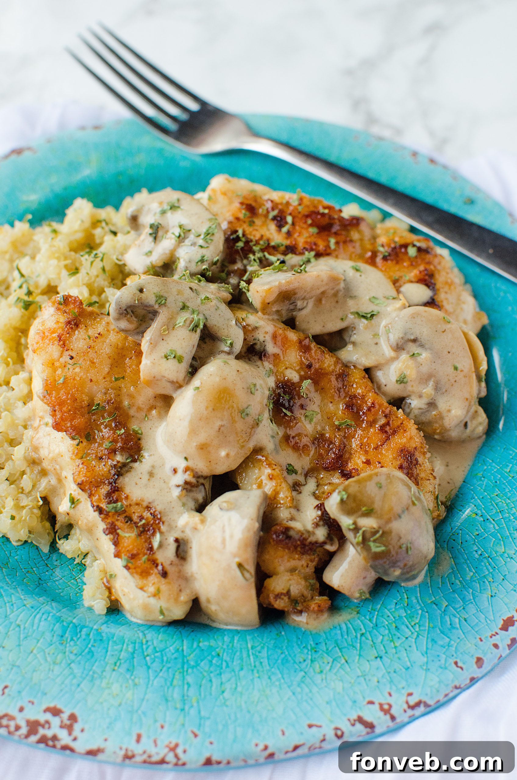 Another perspective of the Creamy Asiago chicken, highlighting its rich texture