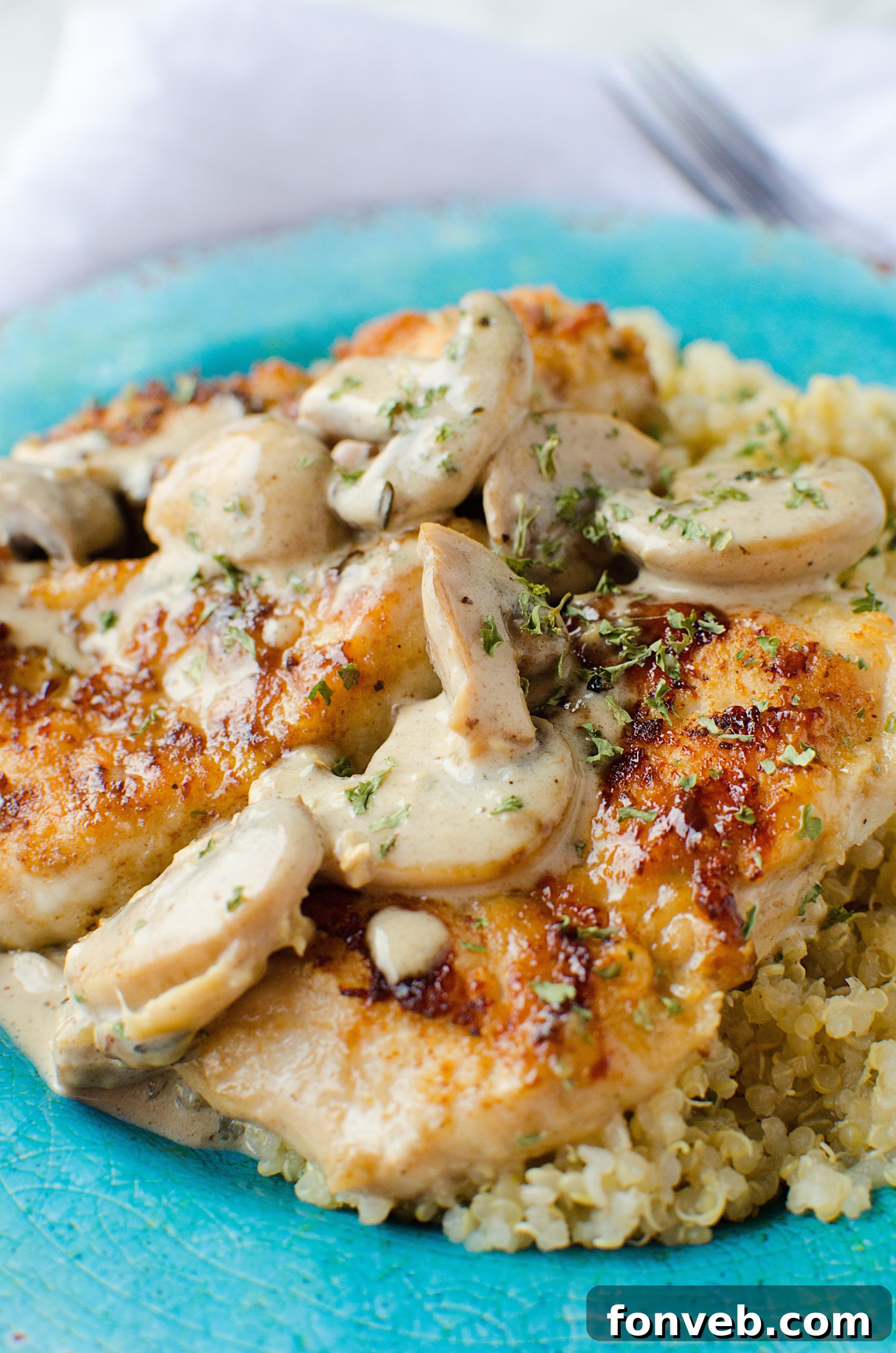 Closeup shot of Creamy Asiago chicken, showing the depth of the sauce