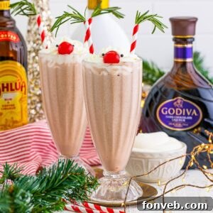 Drunk Rudolph Milkshakes on table with alcohol behind glasses