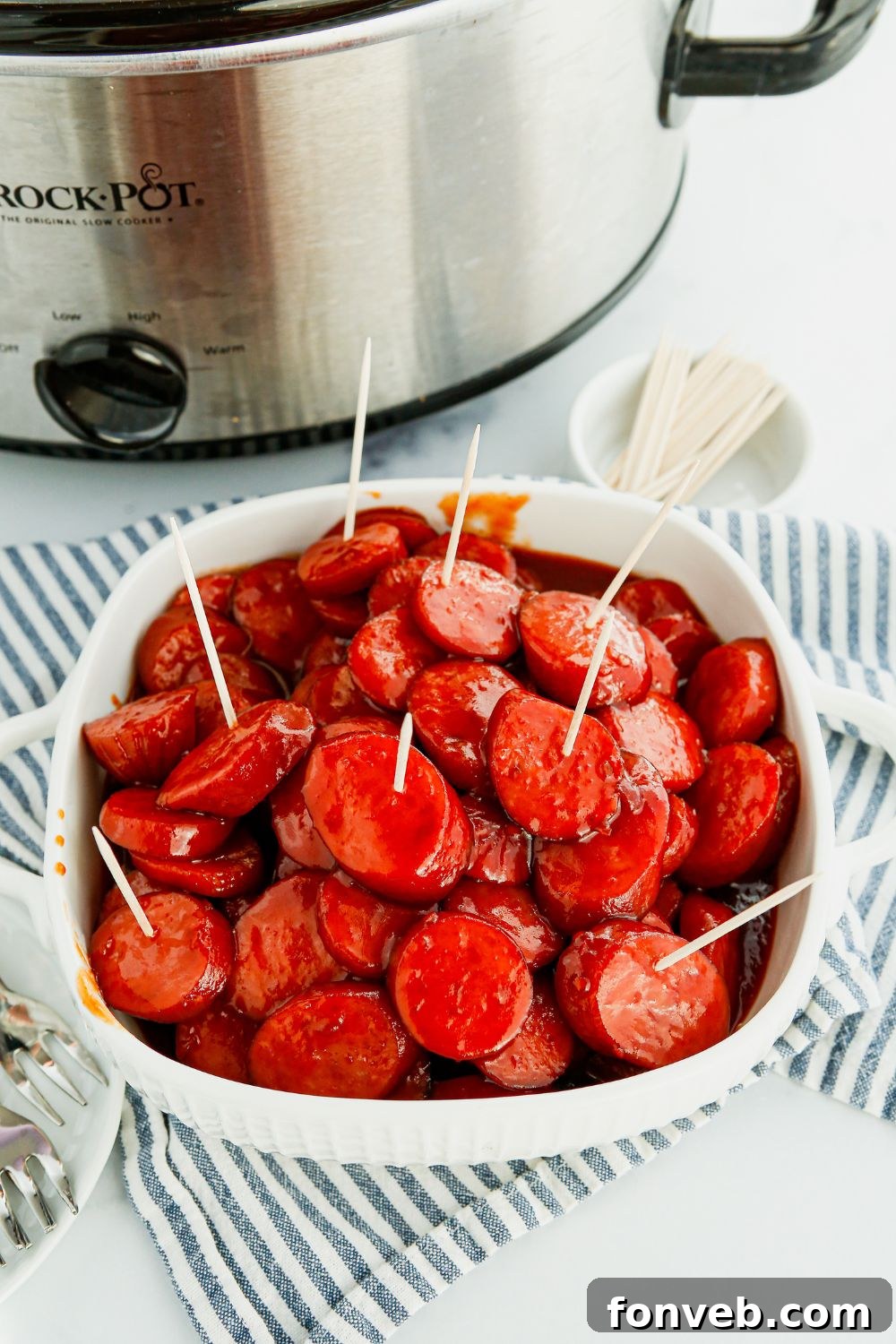 Crockpot Kielbasa Bites, a party appetizer with smoked sausage, chili sauce, and grape jelly.