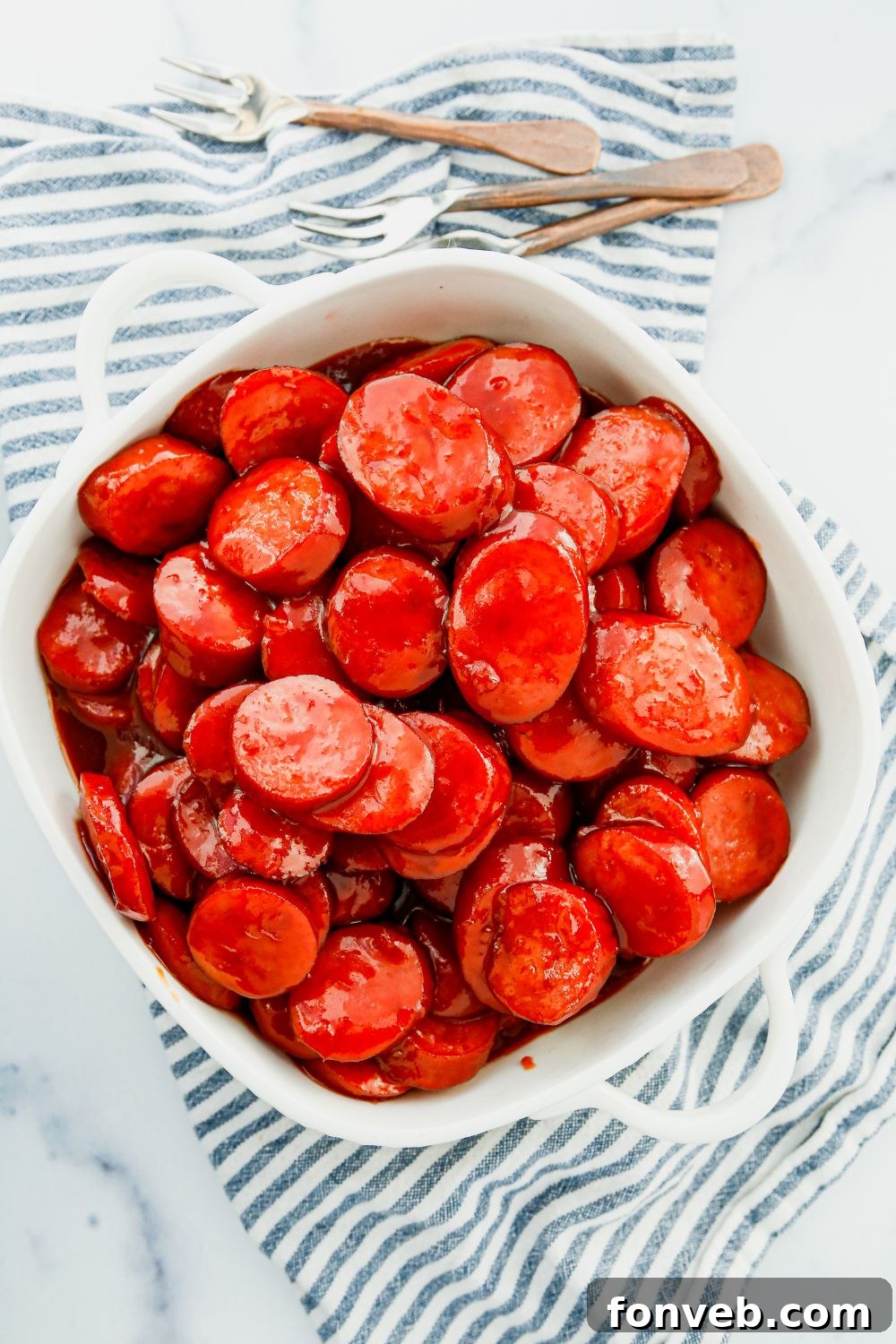 Hearty slices of Polish sausage (kielbasa) in a serving bowl, ready to be sauced.