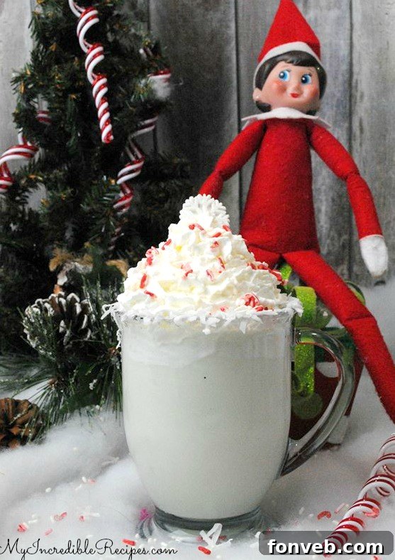 A festive holiday elf peeking over a glass of white hot chocolate, hinting at adult beverage options