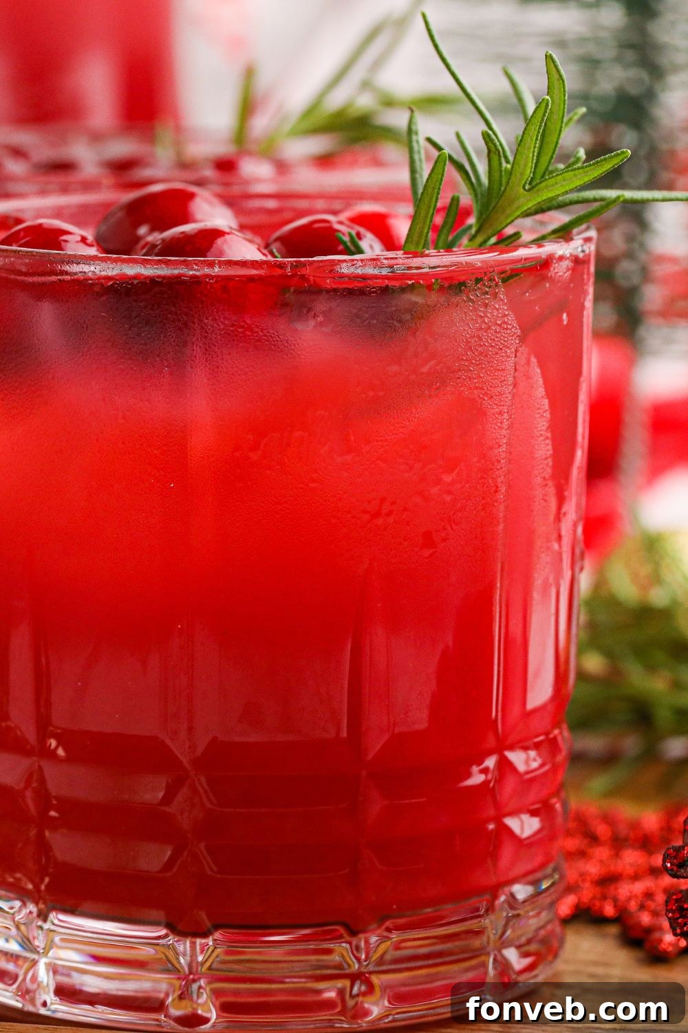 Yuletide Kiss Punch 12 side view of cranberry orange punch in a glass