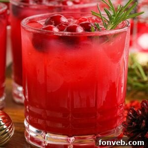 Yuletide Kiss Punch 16 Mistletoe Punch in a glass with garnish