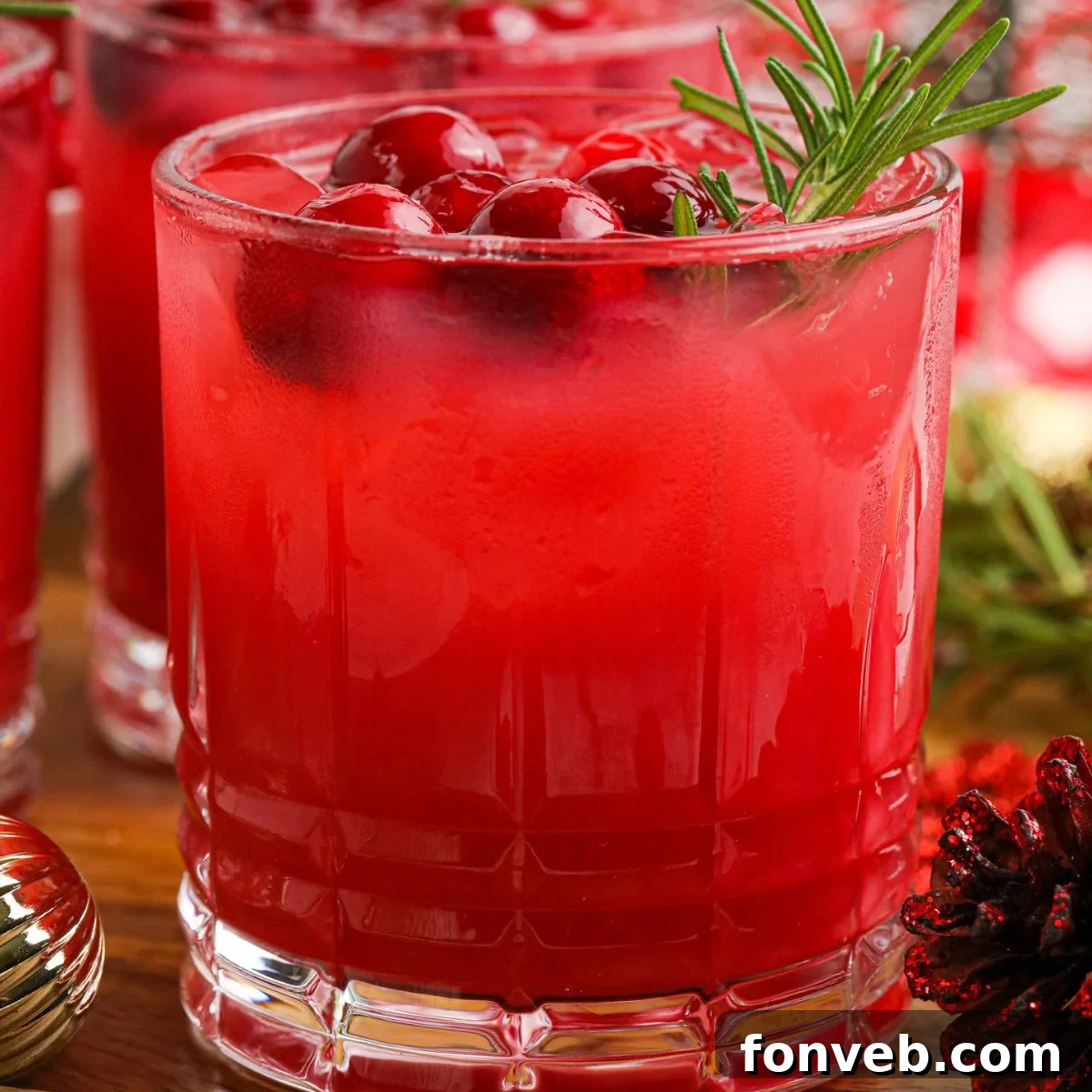 Yuletide Kiss Punch 3 Mistletoe Punch in a glass with garnish