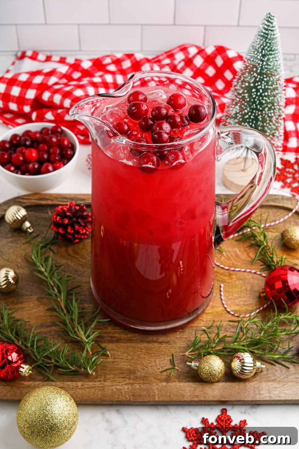 Yuletide Kiss Punch 8 santa punch in a glass pitcher