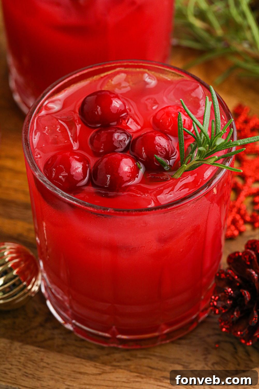 Yuletide Kiss Punch 9 glasses of red punch on table