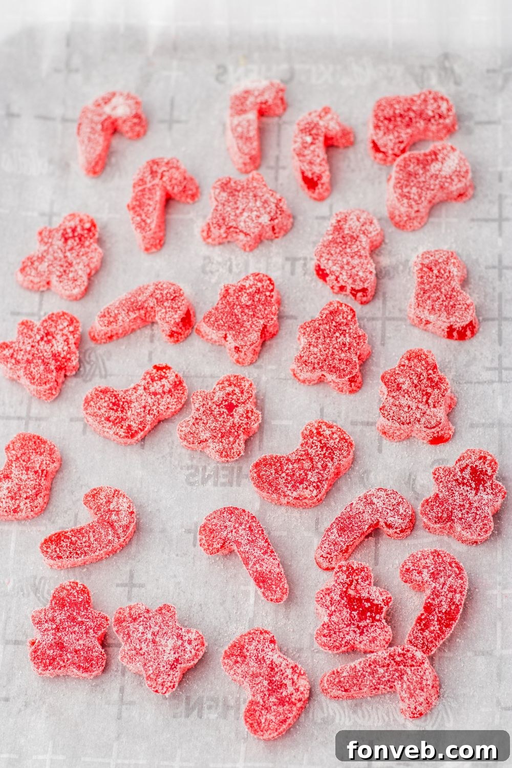 Yuletide Jewels 14 Red gumdrops rolled in sugar on a table
