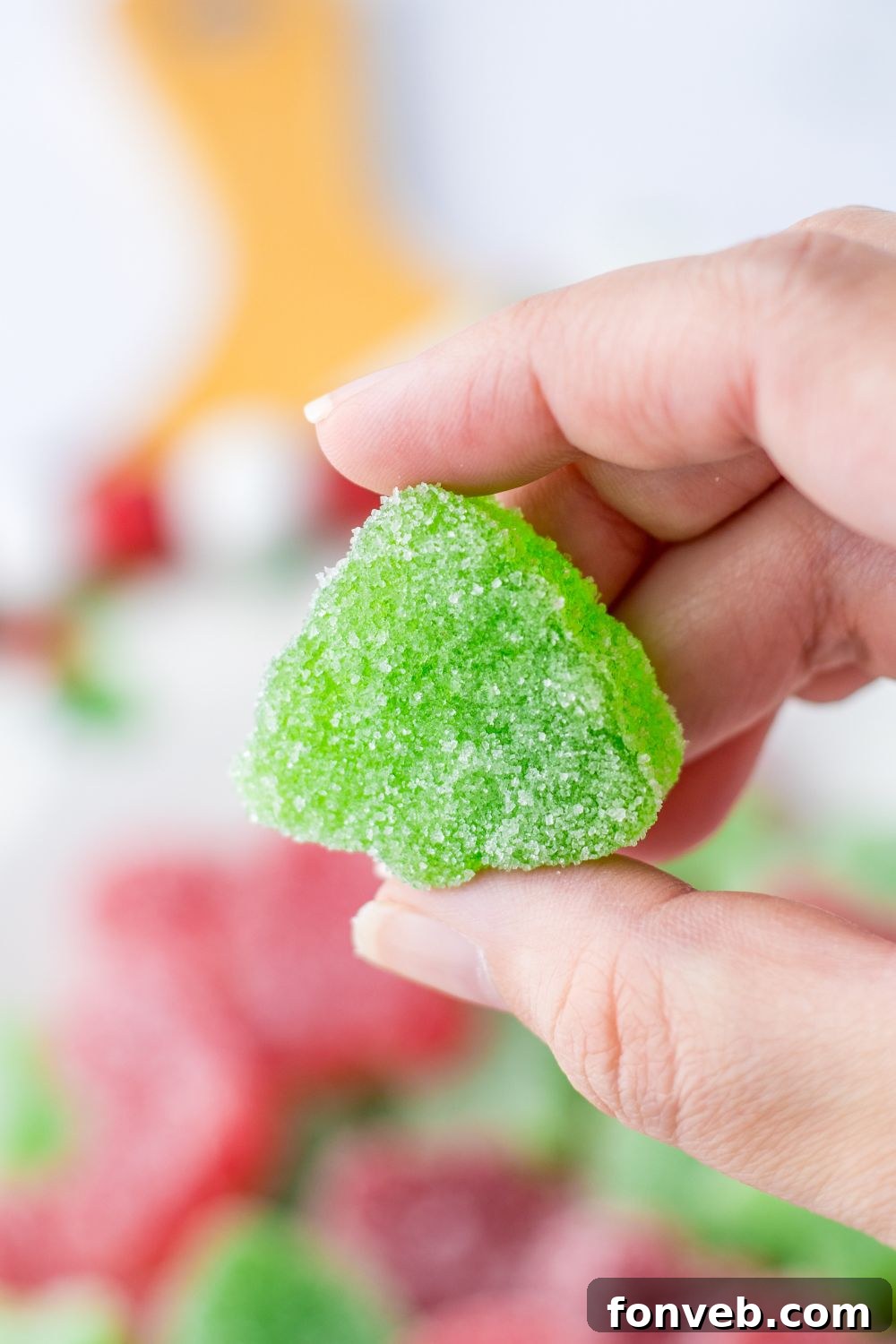 Yuletide Jewels 18 Holding a green gummy