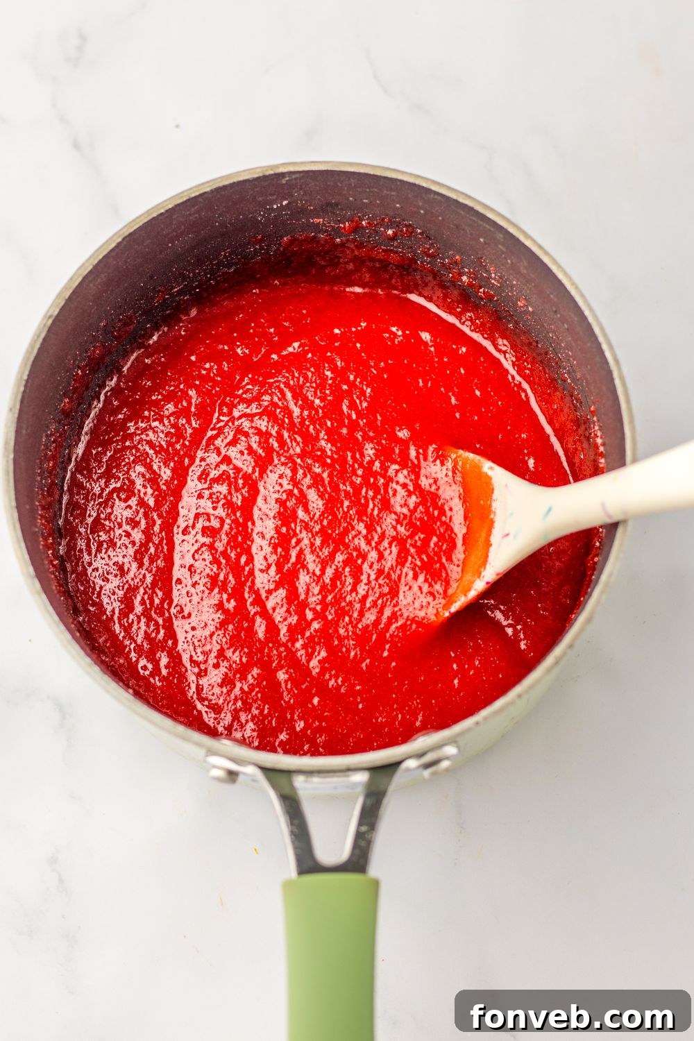 Yuletide Jewels 8 Applesauce mixture being stirred in a pan