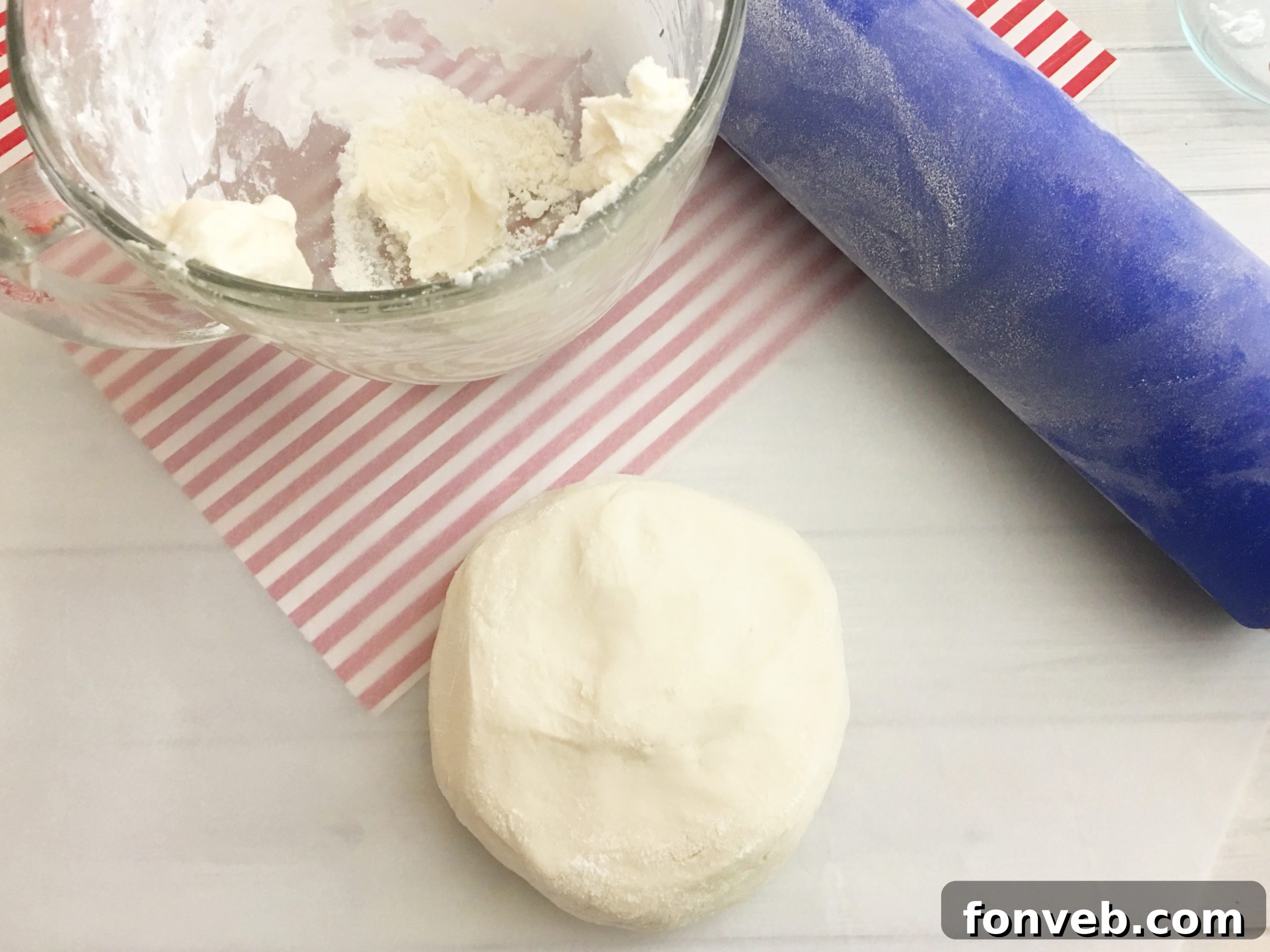 Easy Homemade Peppermint Patties 4 Homemade peppermint patties being dipped in melted chocolate